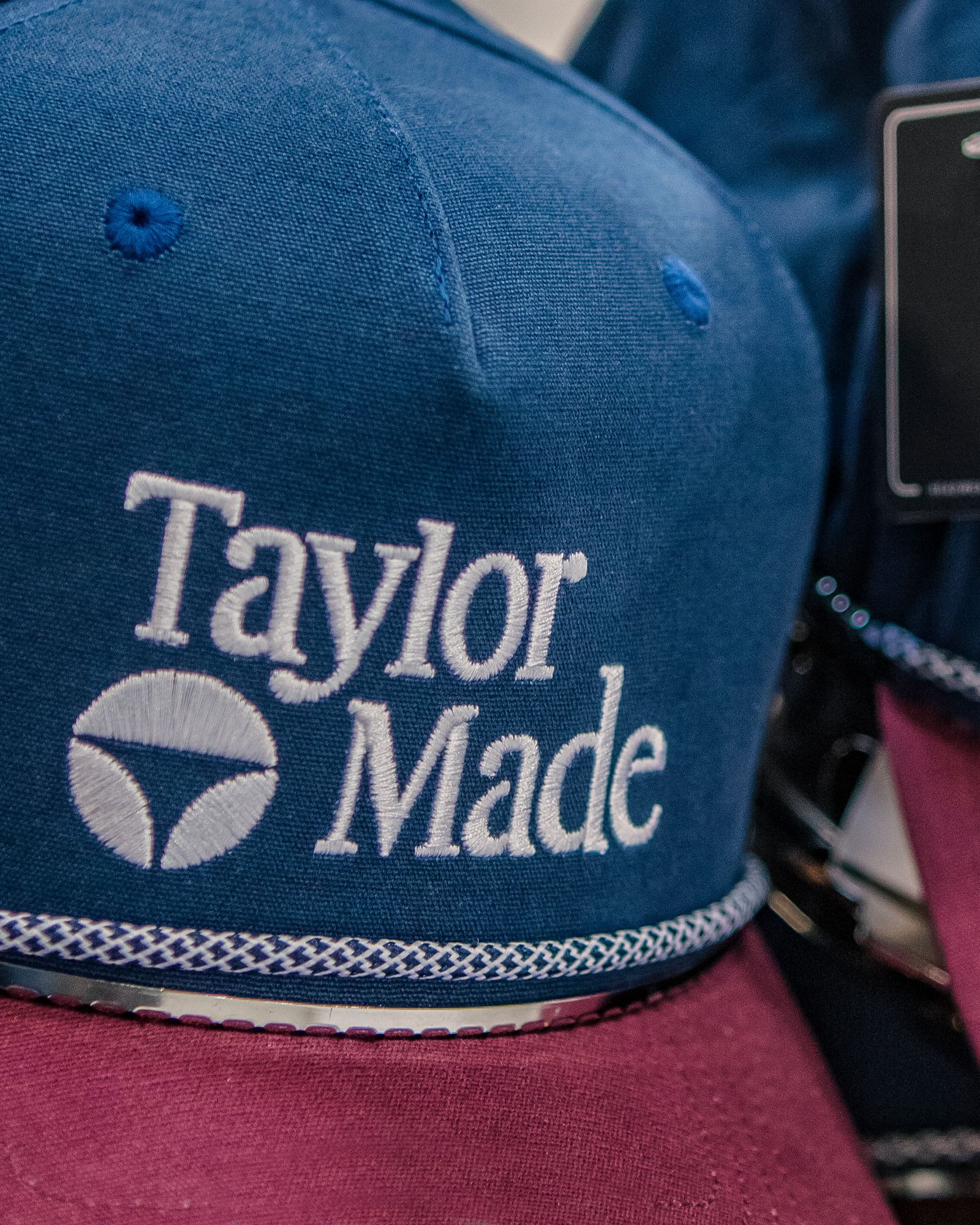 Close up of Taylor Made hat embroidery.