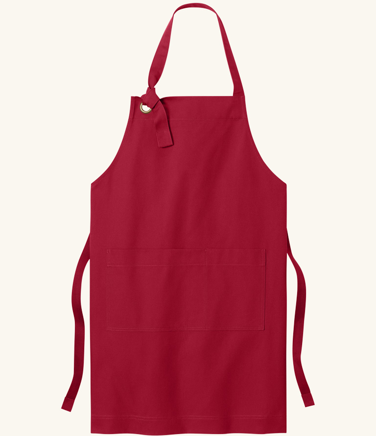 Red apron with adjustable neck strap.
