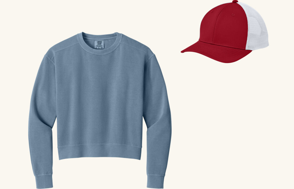 Blue sweatshirt and red cap.