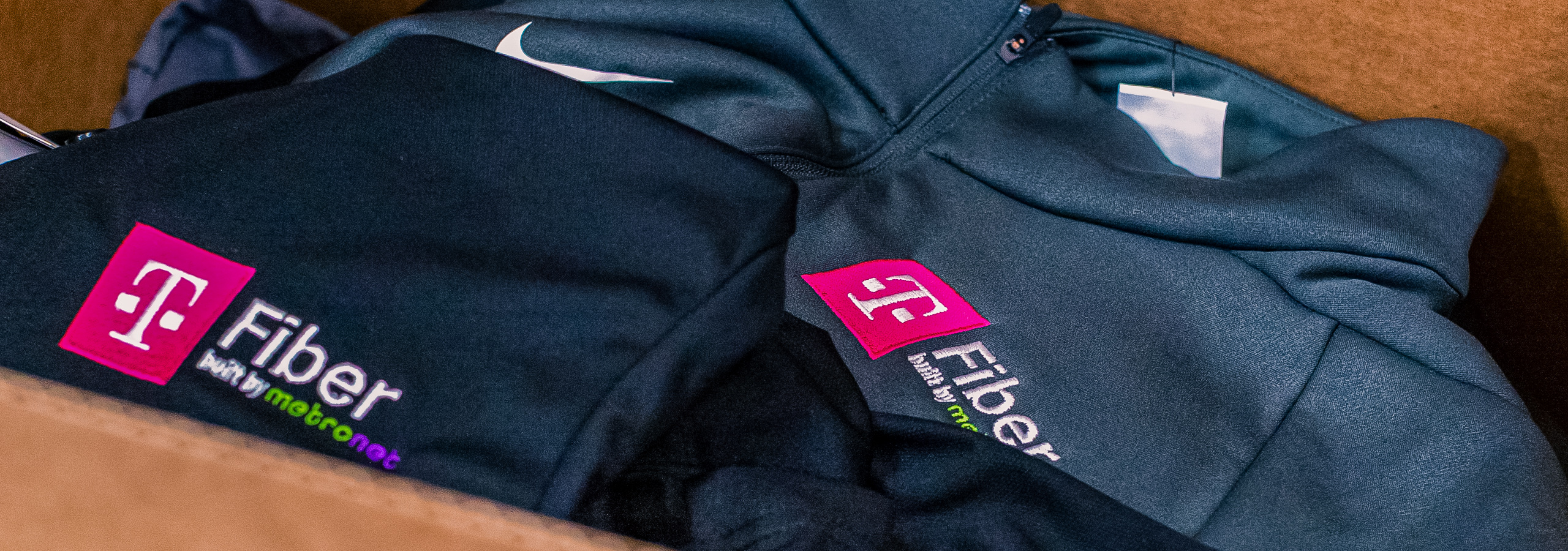 T-Fiber embroidered zip-up apparel.