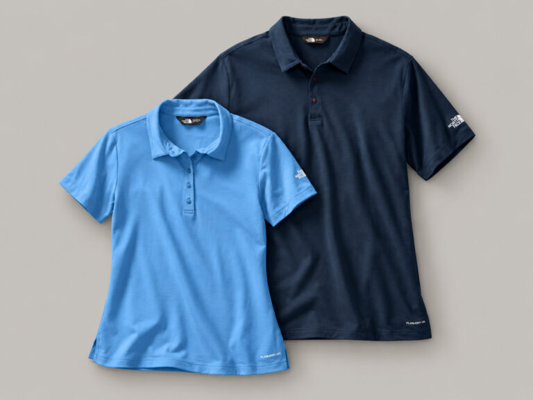 Light blue and navy short-sleeve polo shirts arranged flat.