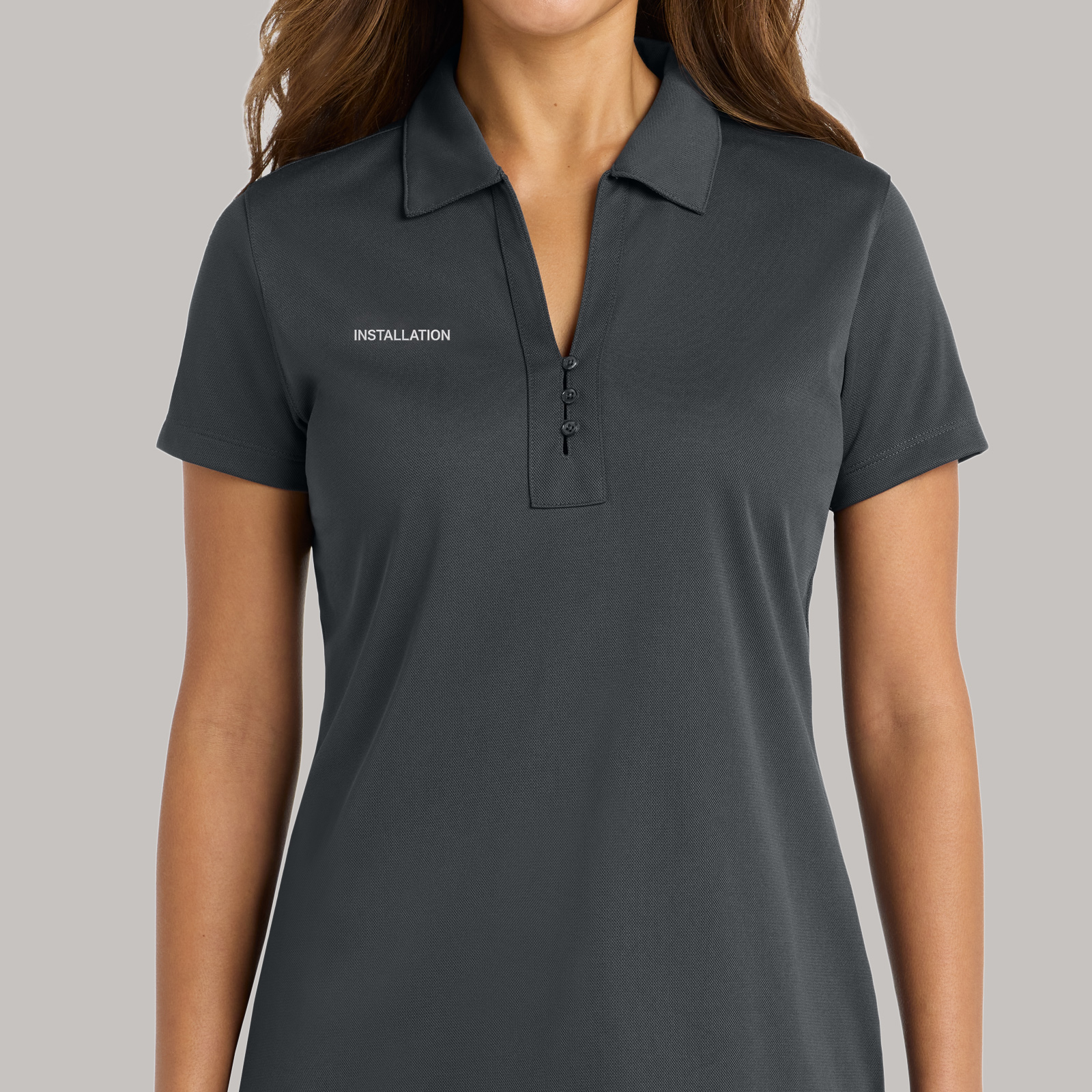 Charcoal polo with "Installation" lettering on the wearer's right chest.