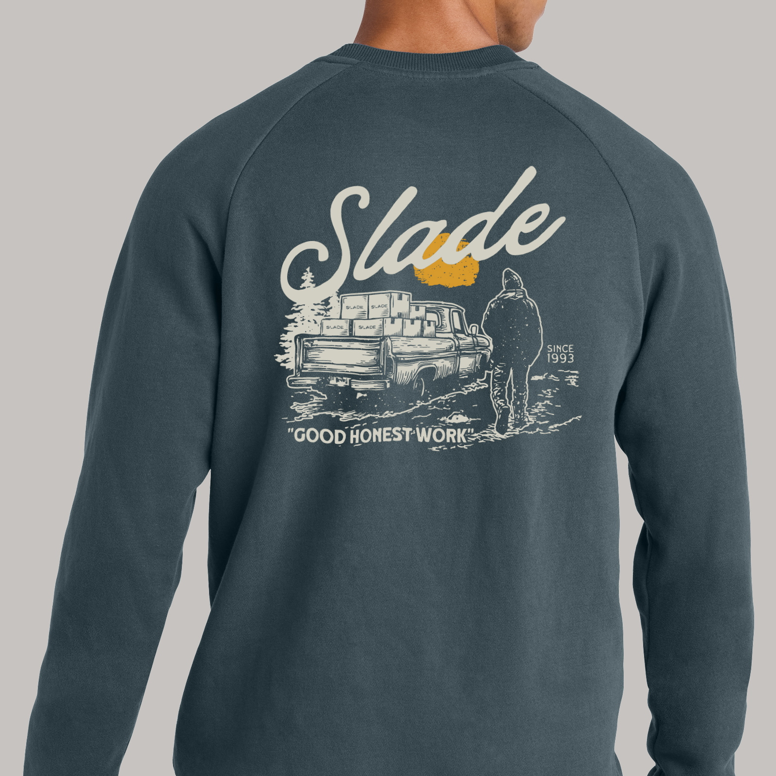 Dark sweatshirt with a large Slade graphic printed across the back.