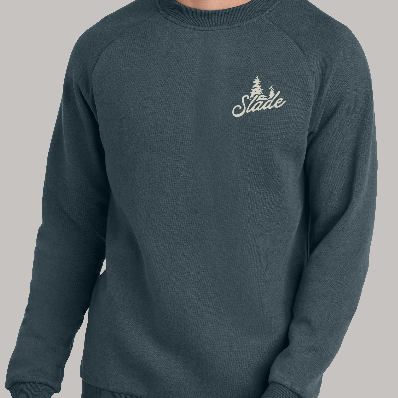 Dark sweatshirt with a small Slade logo printed on the wearer's left chest.