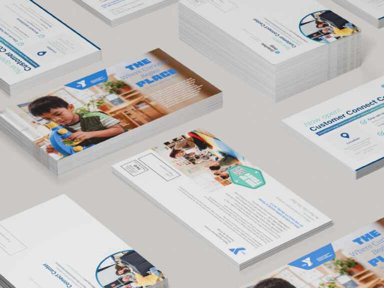 Stacks of YMCA and CenterPoint Energy mailing postcards showing promotional fronts and addressed backs.