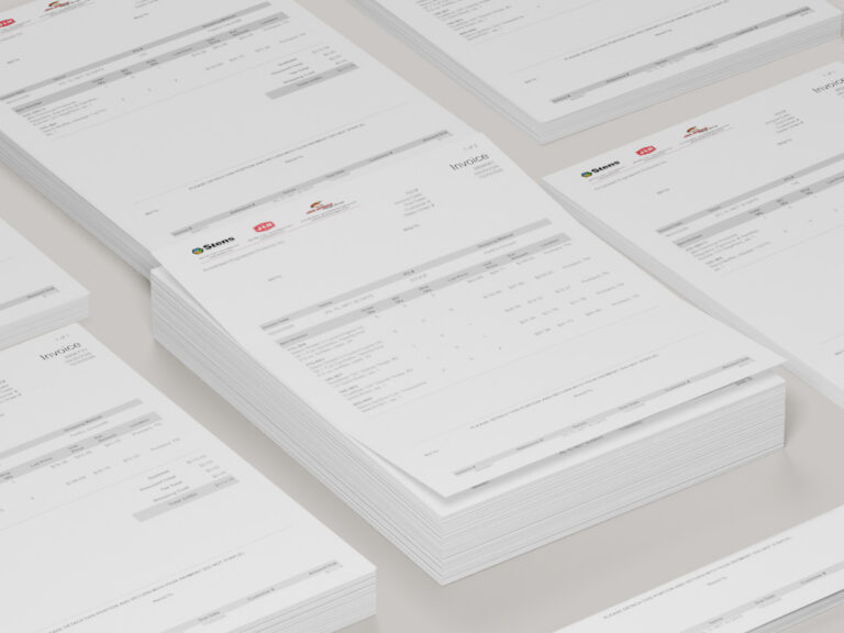 Stacks of printed invoices with company logos, itemized charges and detachable payment slips.