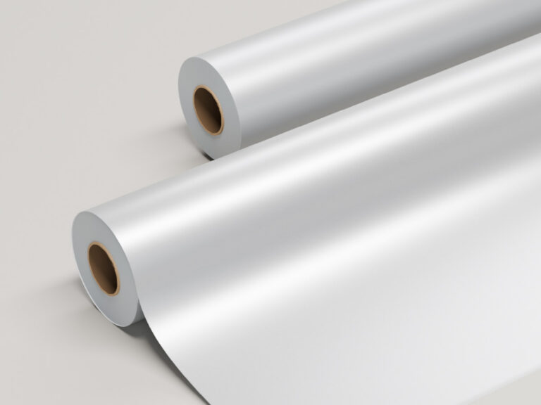 Two rolls of matte, translucent white film, with one partly unrolled.