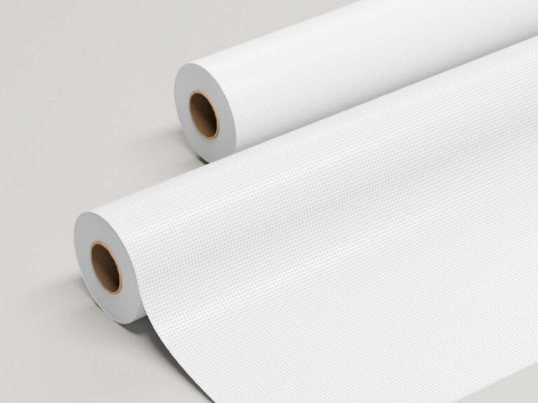 Two rolls of white perforated sign film, with tiny holes visible on the unrolled section.