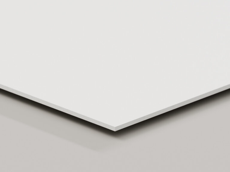 White sign board shown at an angle to reveal its solid edge.