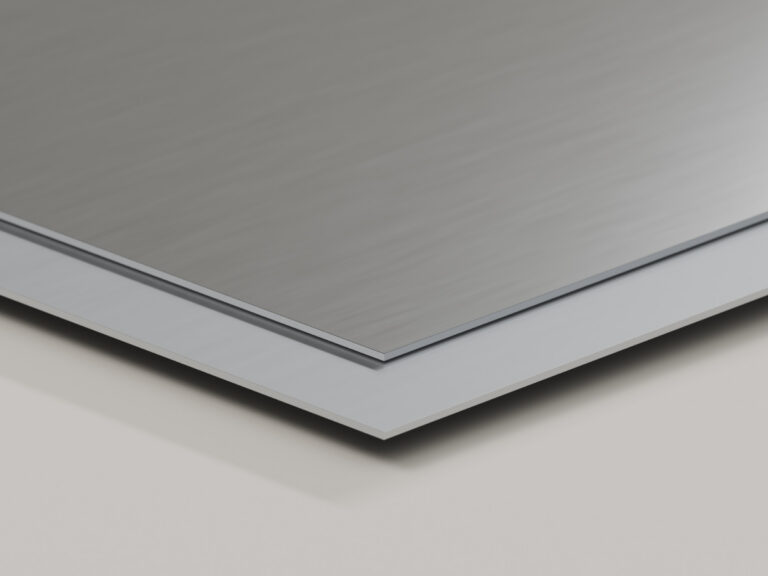 Brushed metal sheet stacked over a thicker white sign panel.